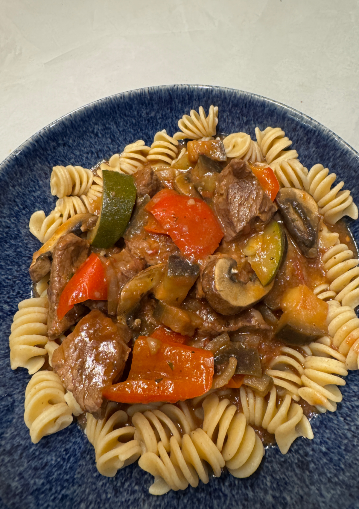 Mediterranean Beef Stew served over pasta