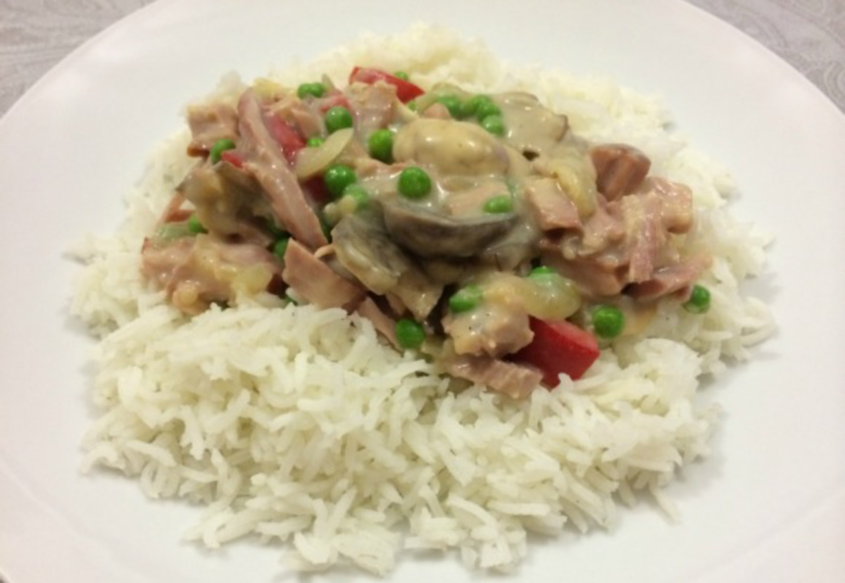 Creamy Turkey on Rice served on a white plate