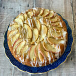 A whole Apple Cinnamon Yogurt Cake served on a Blue Willow plate