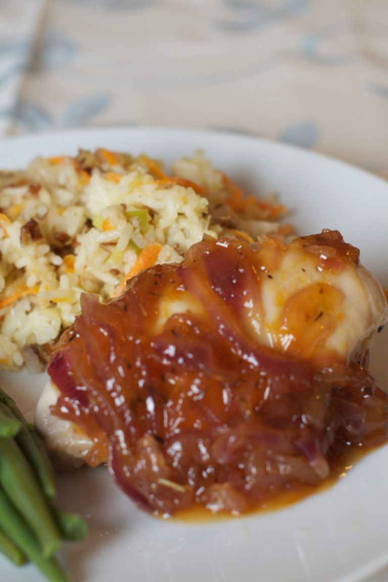 Apricot and Onion Chicken served on a plate with rice and green beans