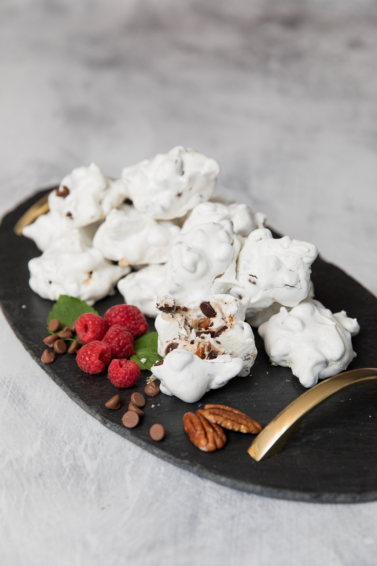 Chocolate Chip and Pecan Meringues on a slate plate