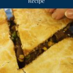 A slice being taken from a piece of a Roast Beef Pot Pie recipe. You can see the pie filling.