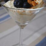 Lemon and Blueberry Syllabub served in a martini glass