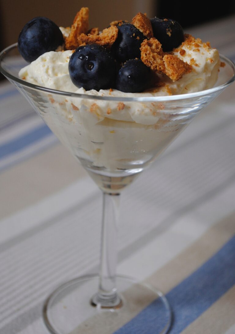 Lemon and Blueberry Syllabub served in a martini glass