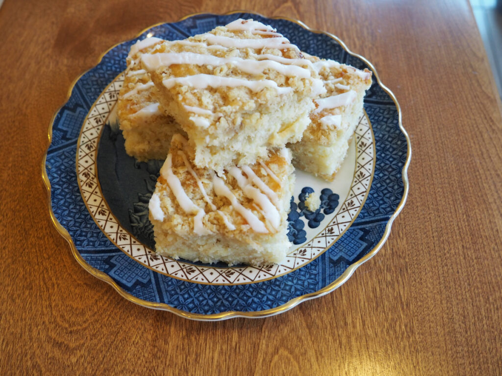 Lemon Almond Streusel Bars, a delicious lemon dessert recipe, cut and served on a Blue Willow plate