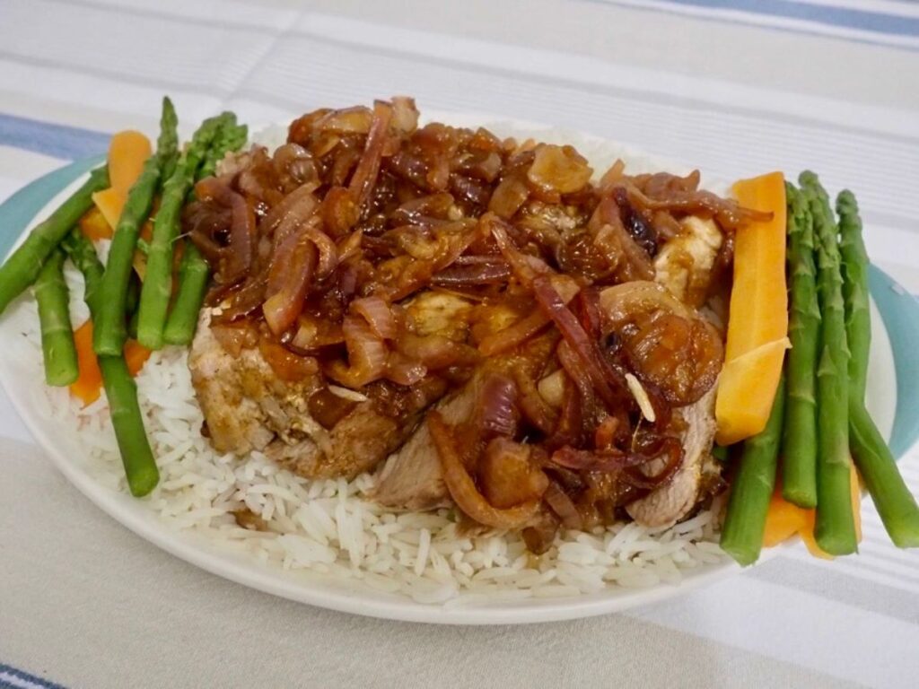Pork covered in Easy Chutney and Bourbon Sauce. There are long sides of carrot and green beans on both sides