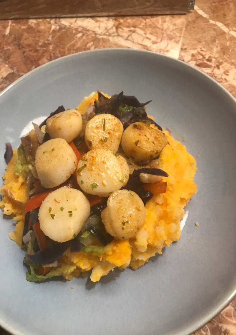 Easy Scallop Supper - tender, plump scallops nestled on a bed of crisp, stir fried veggies & luscious mashed potatoes - served on a blue plate