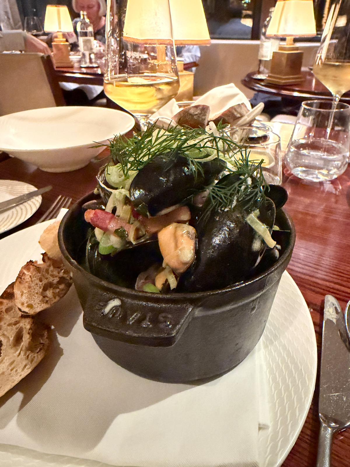 A small cast iron casserole of mussels served at The River Restaurant