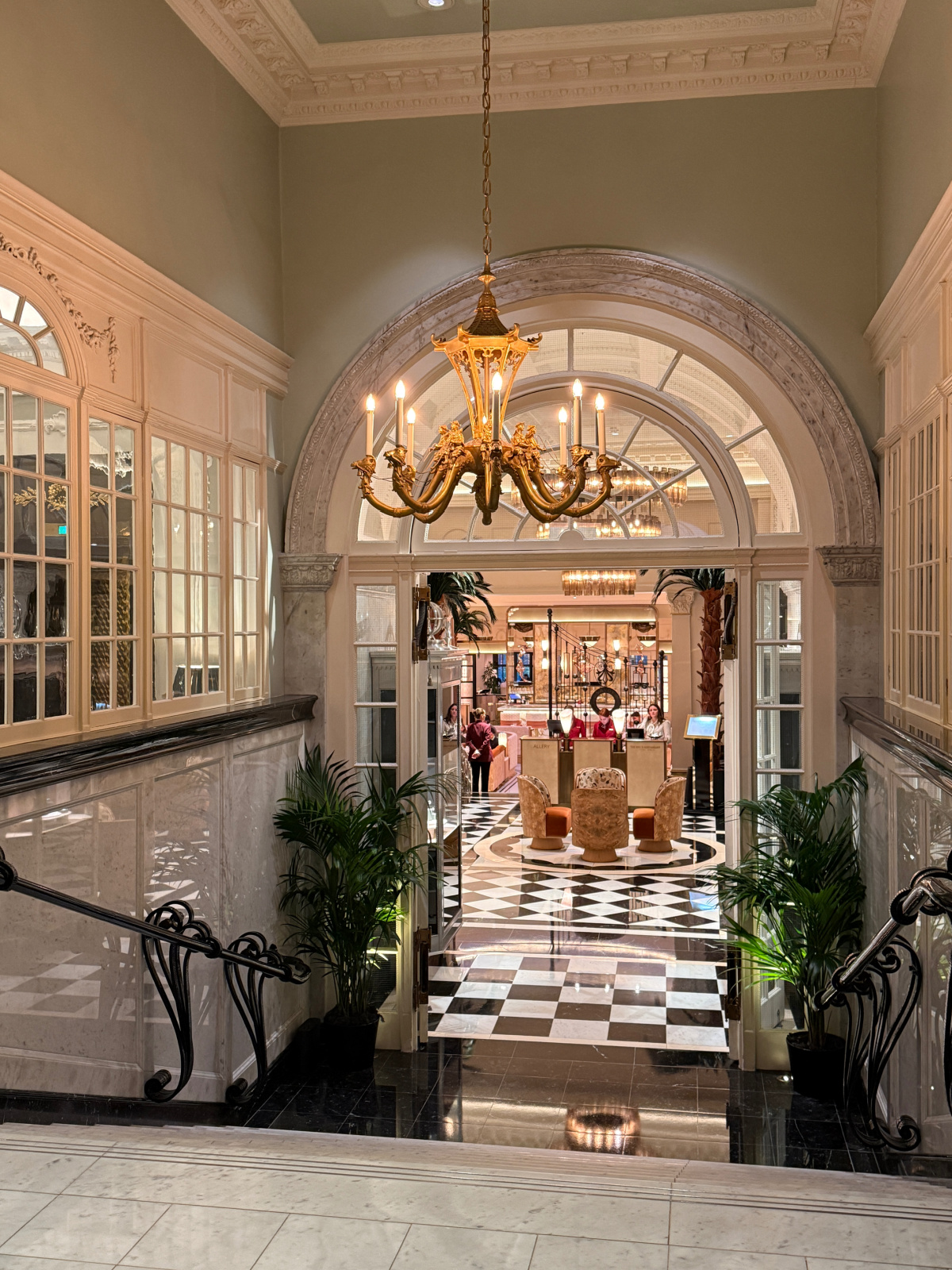 the stairs and entryway leading to some of the restaurants at The Savoy Hotel.