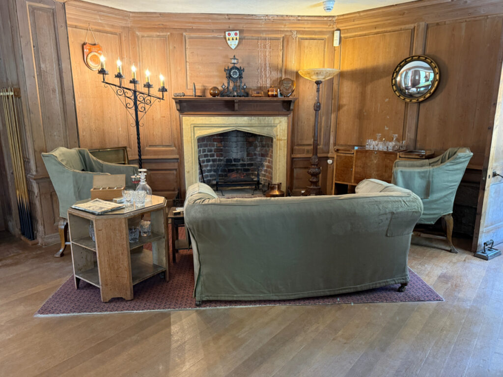 Fireplace and seating area in the billiard room