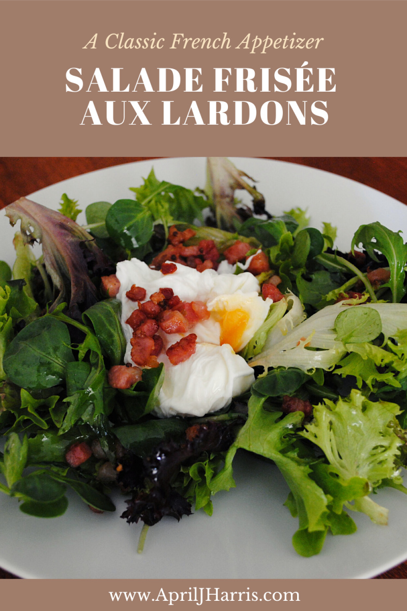 Salade Frisée aux Lardons served on a plate