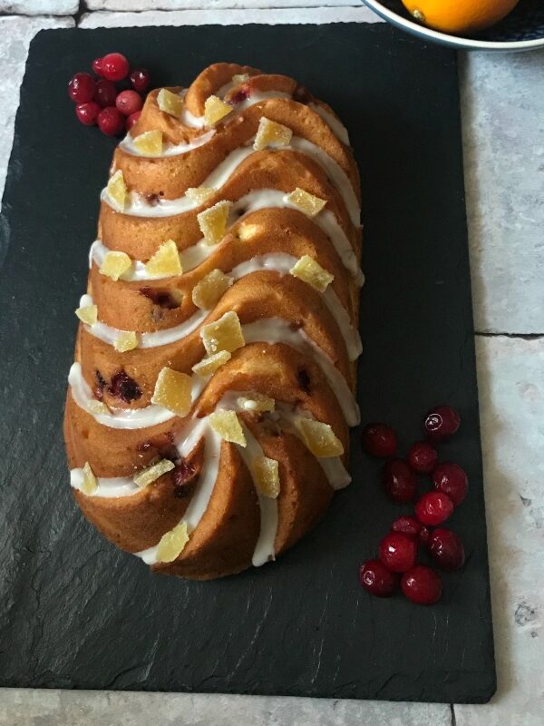 The flavours of Thanksgiving and Christmas combine in this warmly spiced, fruit studded Cranberry Orange and Ginger Loaf Cake Recipe. It's perfect for entertaining, as a thoughtful foodie gift, or just to have on hand for snack emergencies!