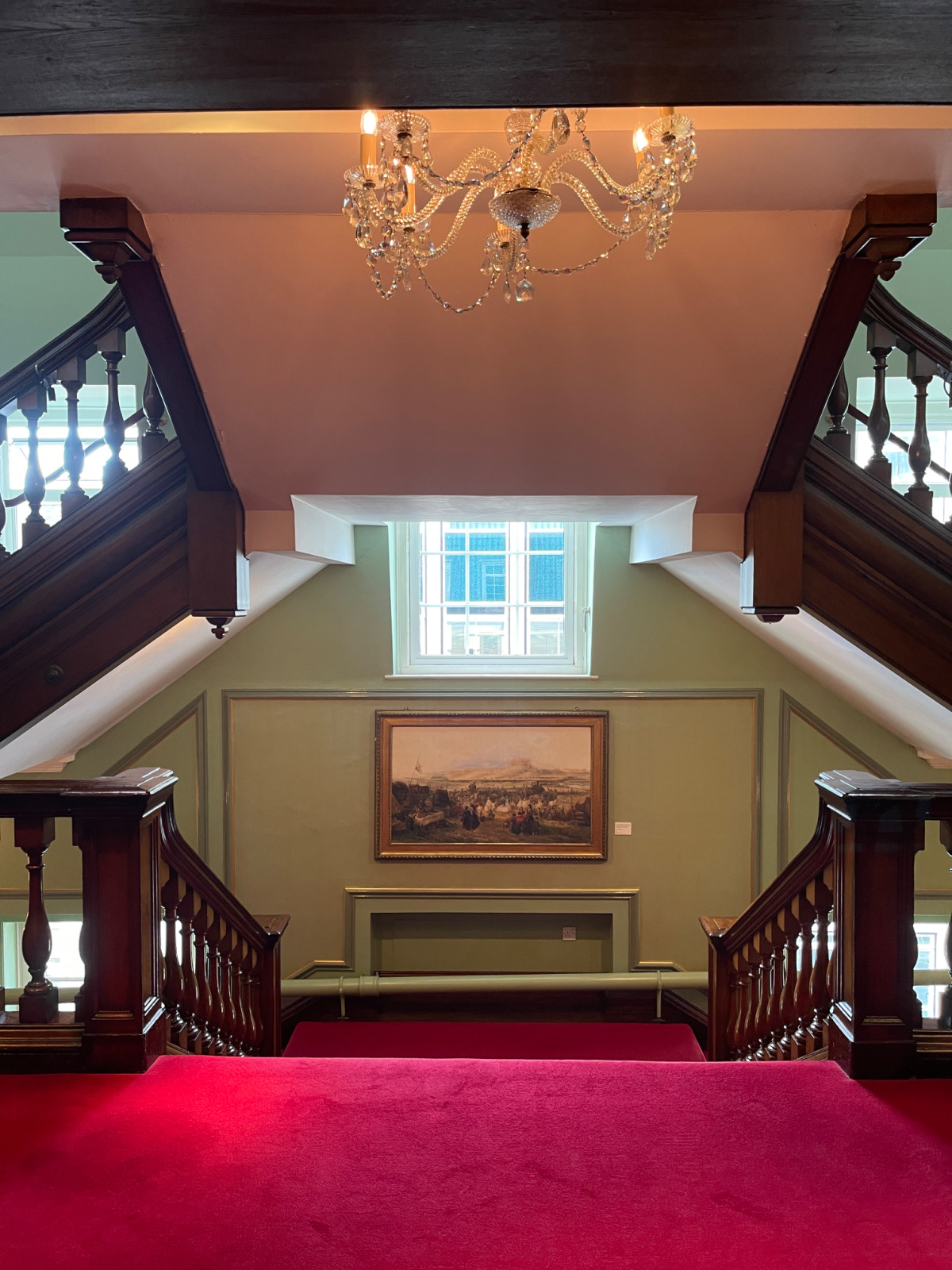 A staircase at F&M carpeted with red carpet