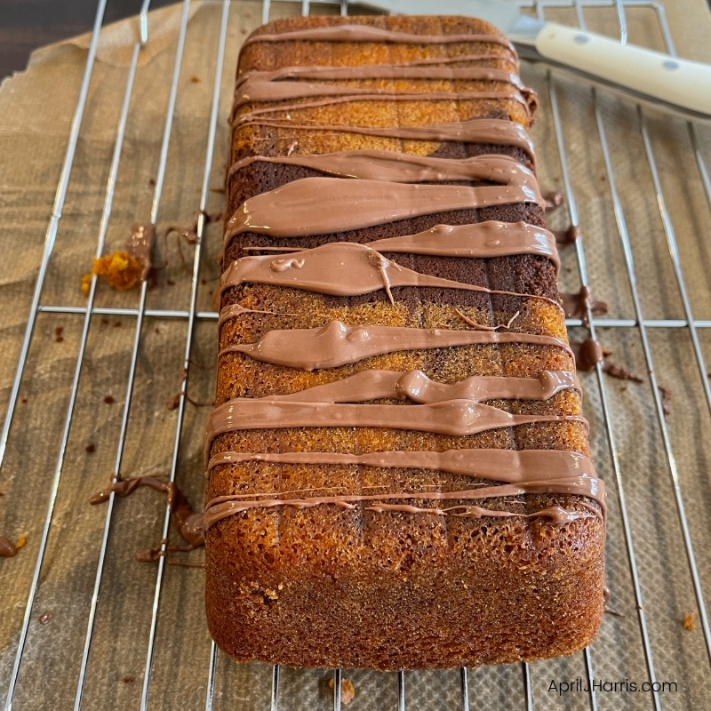The loaf cake with the first layer of glaze