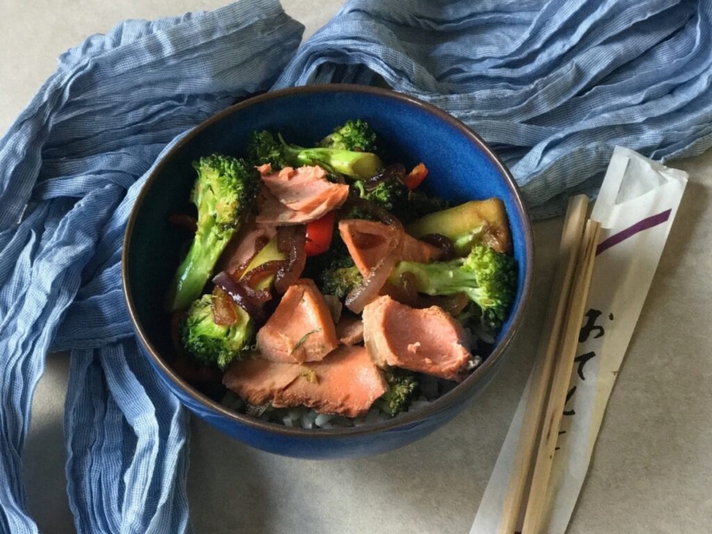 Salmon and Broccoli Stir Fry served in a blue bowl