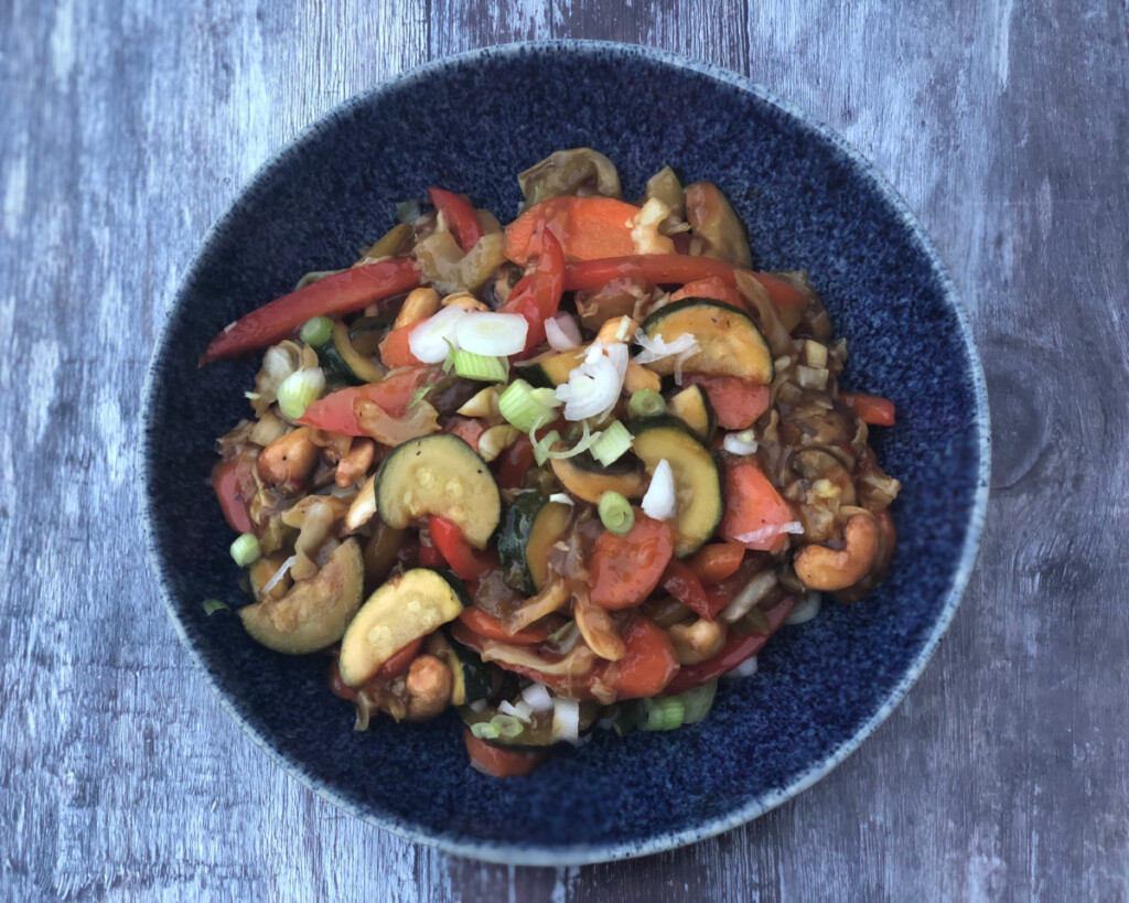 Vegetable and Cashew Stir Fry served in a blue bowl