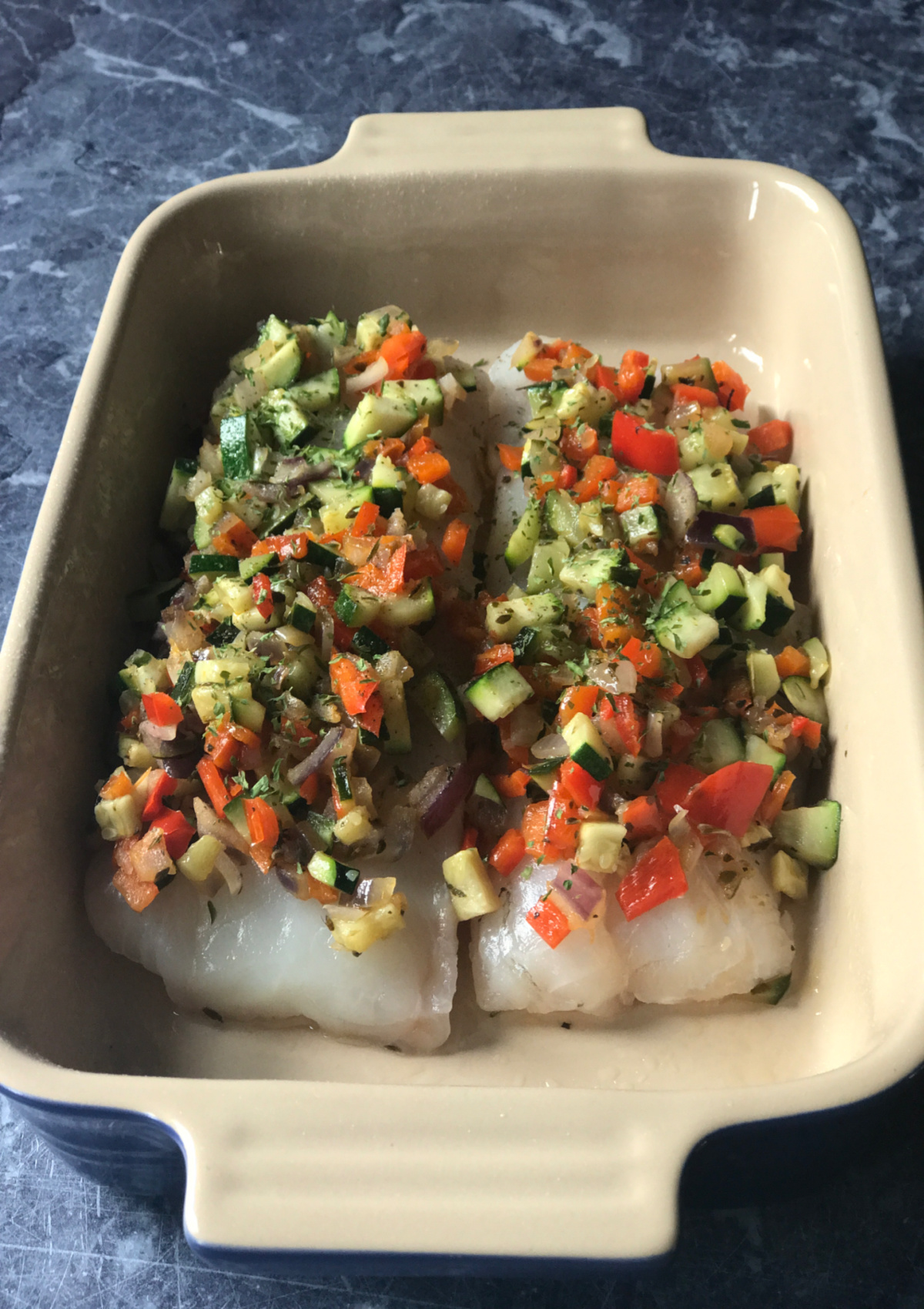 Cod with a Sautéed Vegetable Topping ready to go into the oven