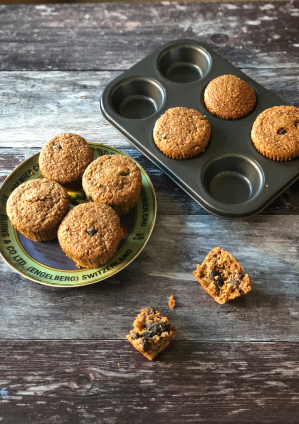 Knotty Pine Bran Muffins on a plate and in a muffin tin