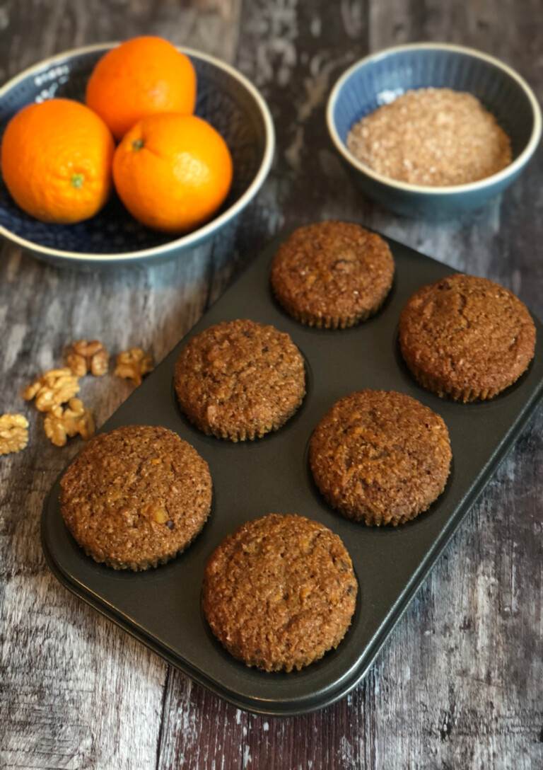 Six Carrot Walnut Bran Muffins in a muffin tin