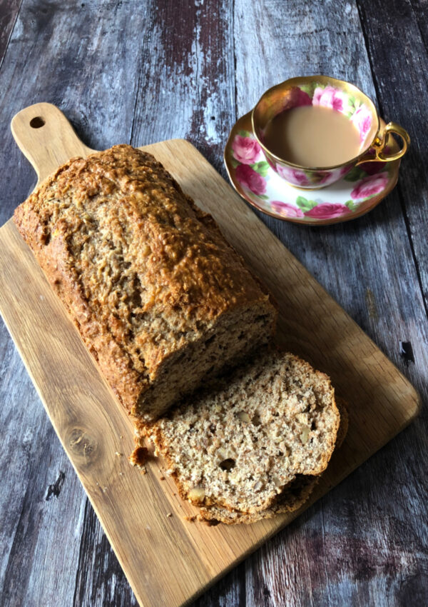 An Old Fashioned Banana Nut Bread served with a cup of tea