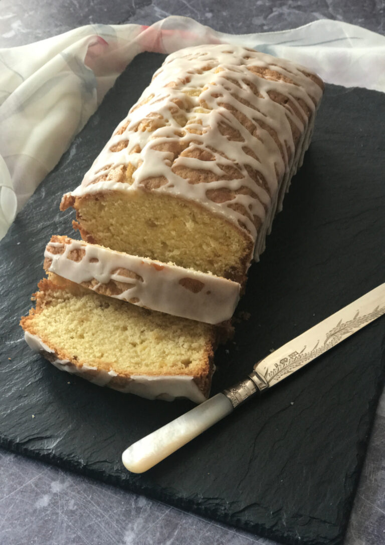 Triple Ginger Pound Cake served on a slate tray with a pearl handled knife alongside