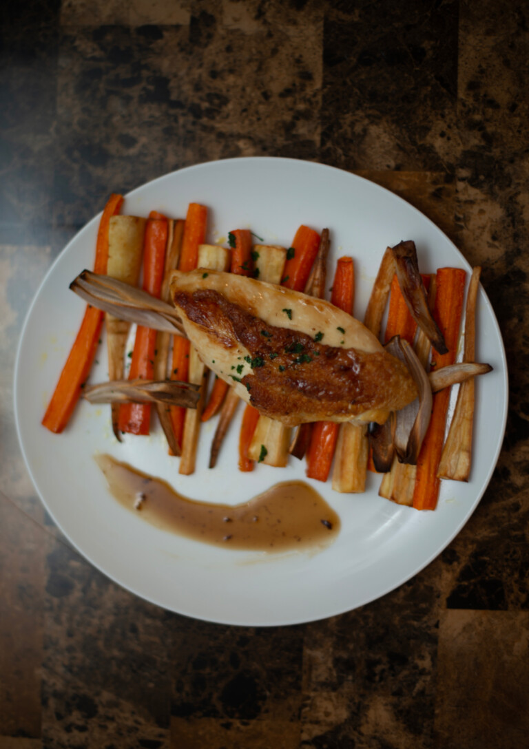 Maple Chicken served on a bed of Roasted Vegetables