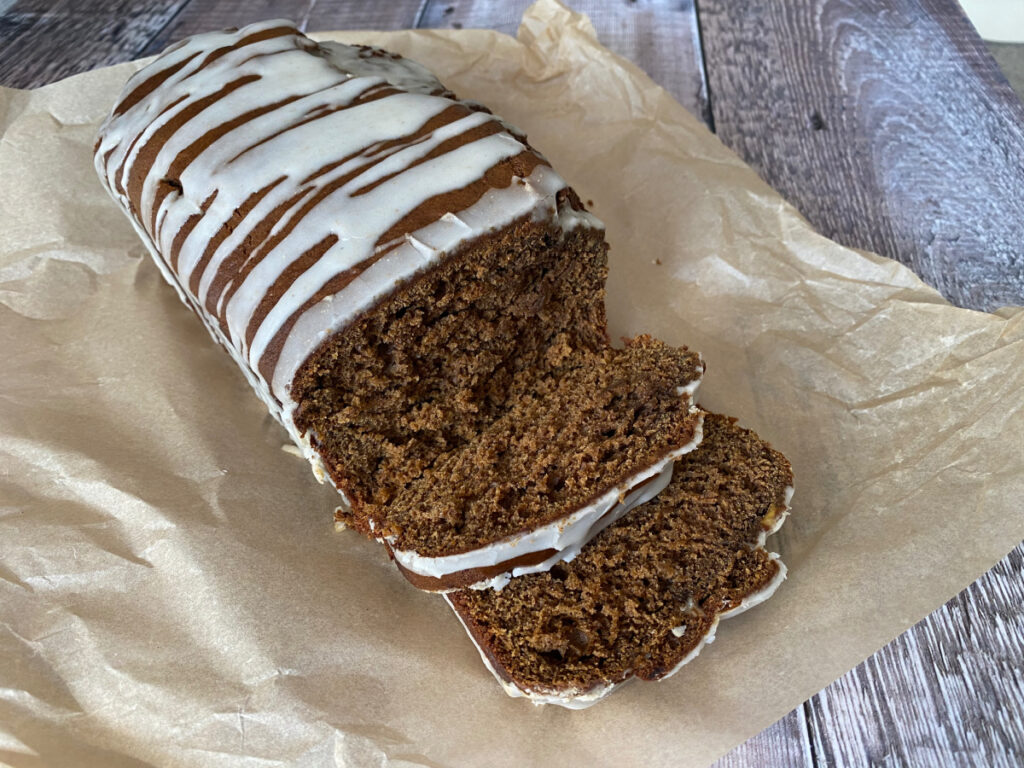 Banana Gingerbread Loaf Cake on a piece of parchment paper. 