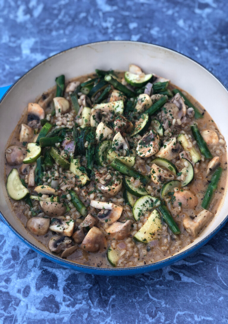 Vegetarian Orzotto in a blue Le Creuset casserole