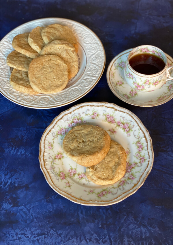 Oatmeal Coconut Cookies served on a plate with a cup of tea alongside