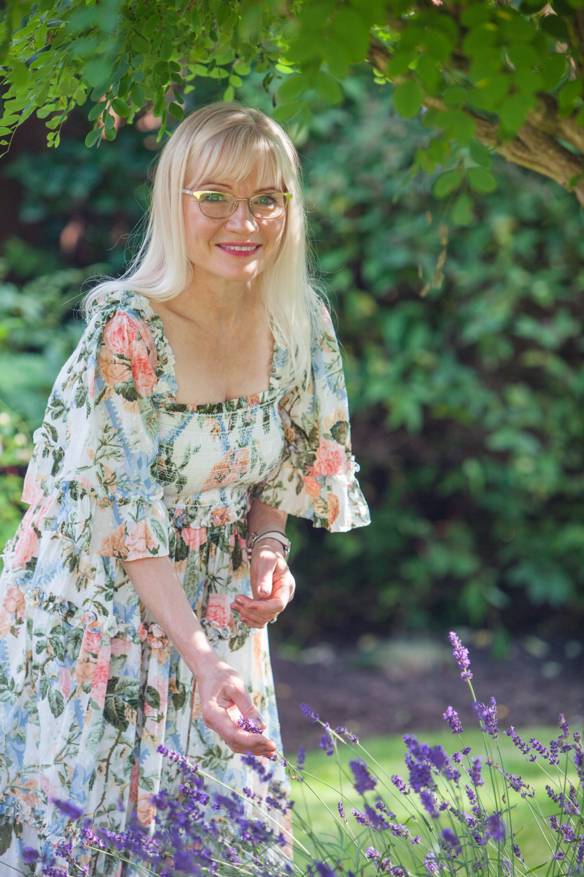 April J Harris in a garden - spring beauty must haves