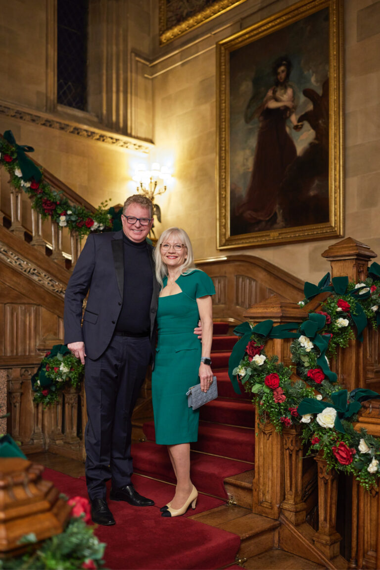 April and Guy Harris on the stairs at Highclere Castle
