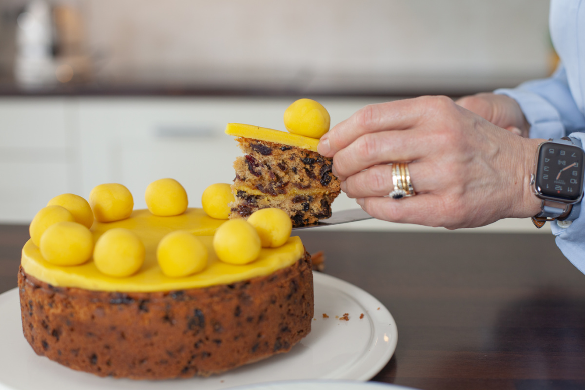 A slice of cake being cut from a Simnel Cake 