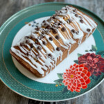 Coffee and Chocolate Chip Loaf served on a cake plate with a floral design