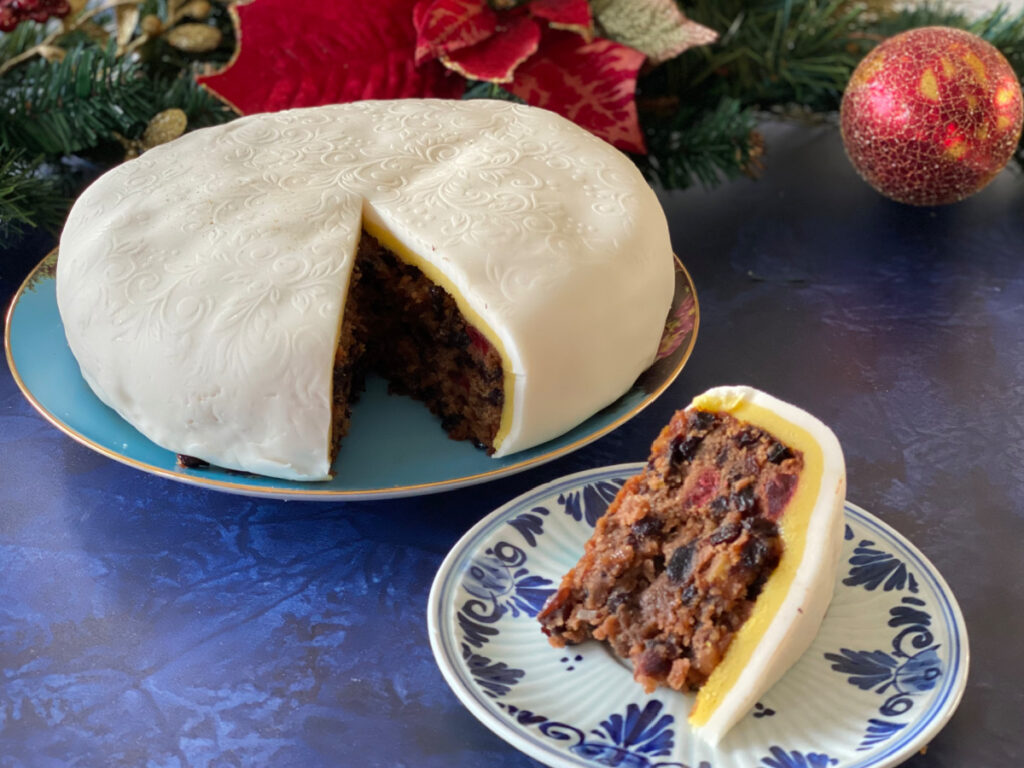 An Old Fashioned British Christmas Cake covered in marzipan and icing