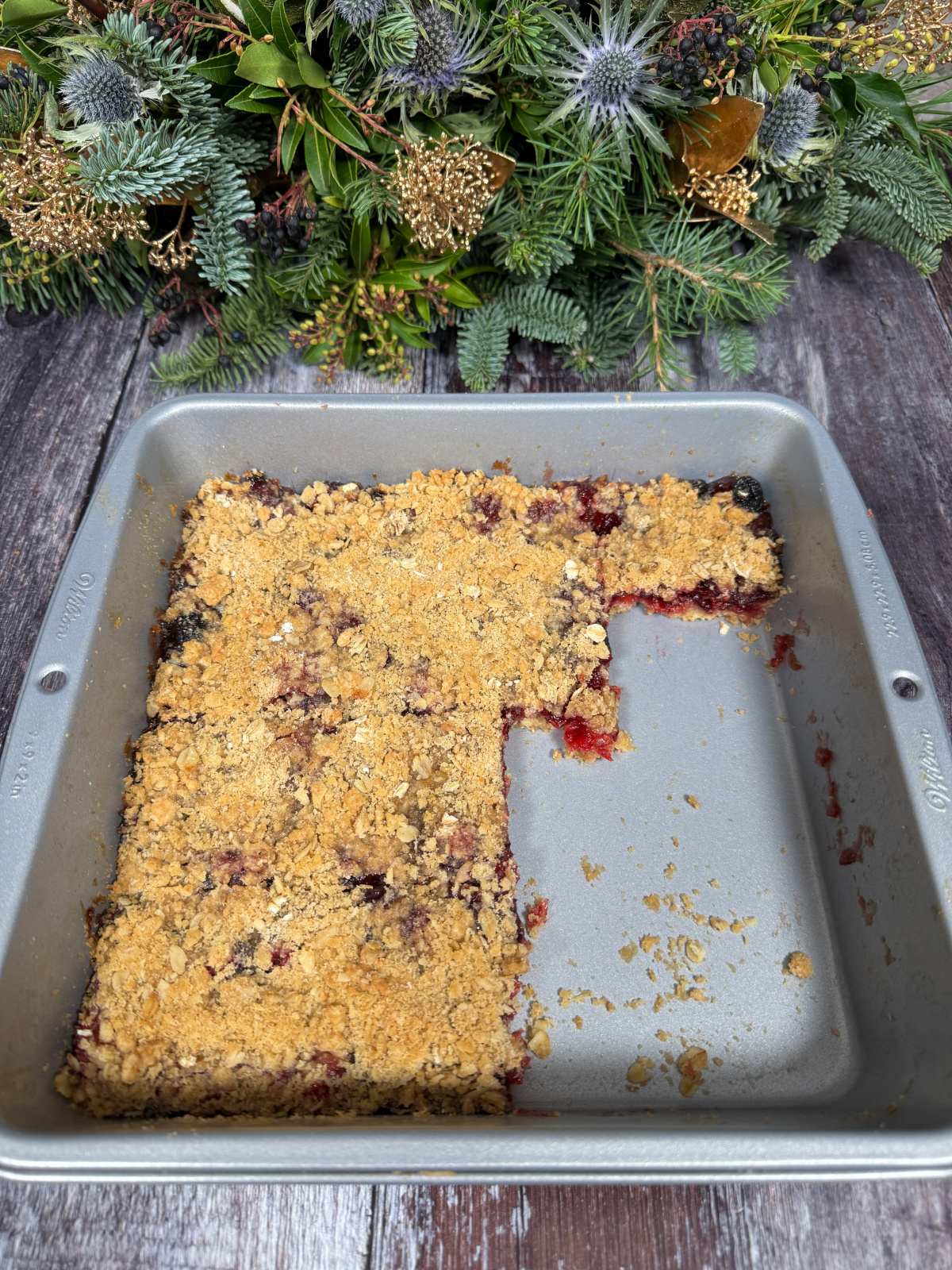 A full tray of Cranberry Oat Crumble Bars with a few bars missing