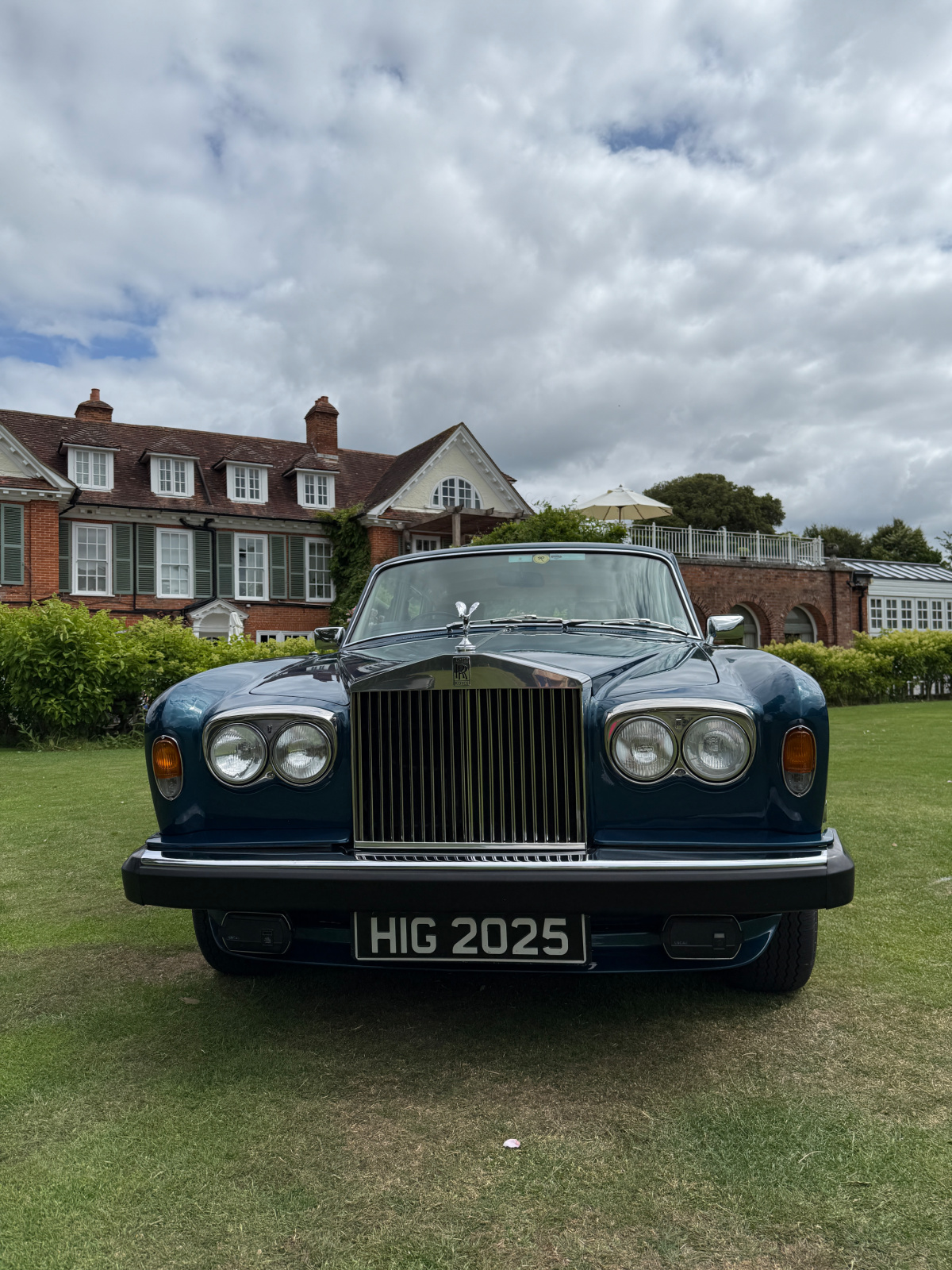 A 1977 Rolls-Royce Silver Shadow II on the lawn in front of Chewton Glen Hotel
